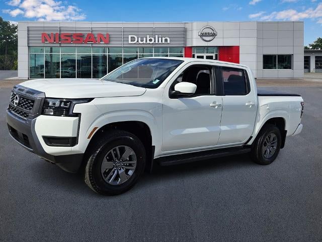 2026 Nissan Frontier Crew Cab SV in Glacier White — front three-quarter view