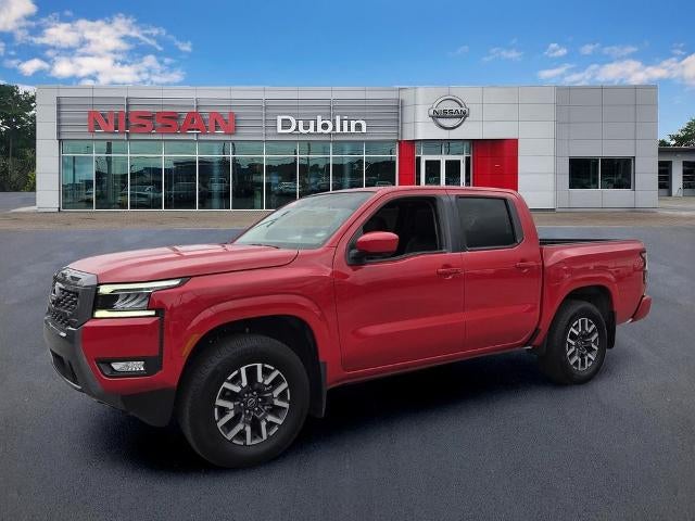 2025 Nissan Frontier Crew Cab SL in Red Alert — front three-quarter view