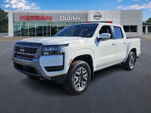 2026 Nissan Frontier Crew Cab SV in Glacier White — front three-quarter view