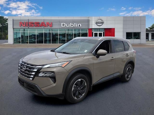 2025 Nissan Rogue SV in Baja Storm — front three-quarter view